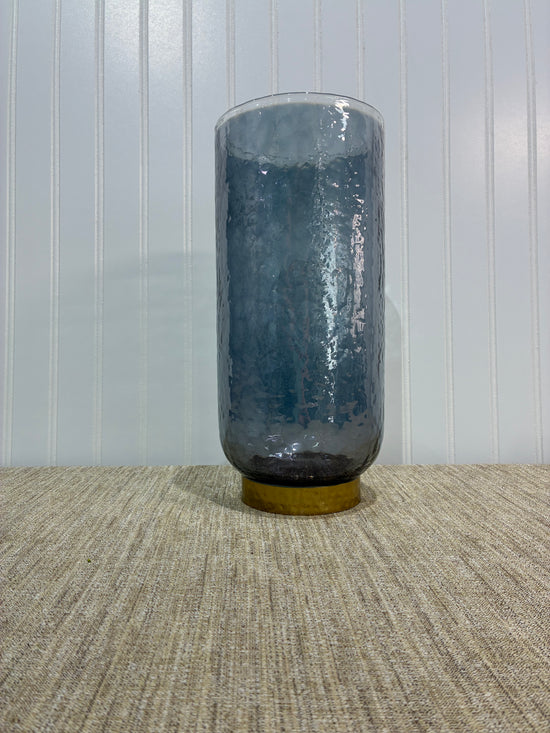 Large Smoky Glass Cylindrical Vase with Gold metal ring on a textured floor