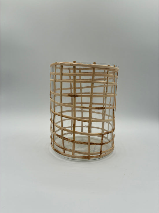 Woven textured glass basket vase on a plain white background