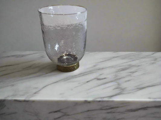 glass vase, completely clear with a gold base