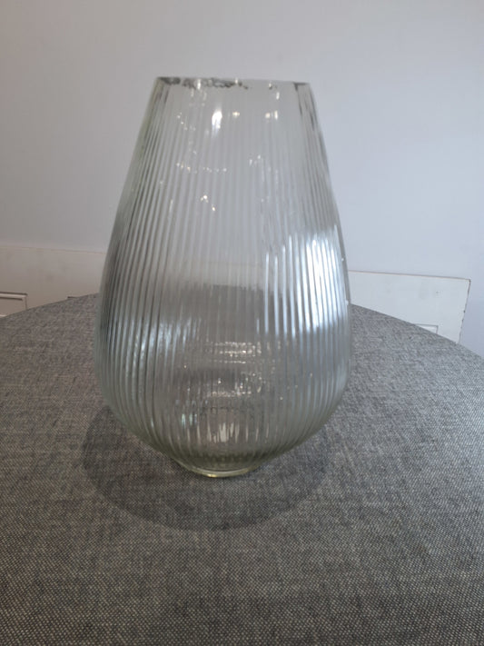 Clear glass vase on a textured surface